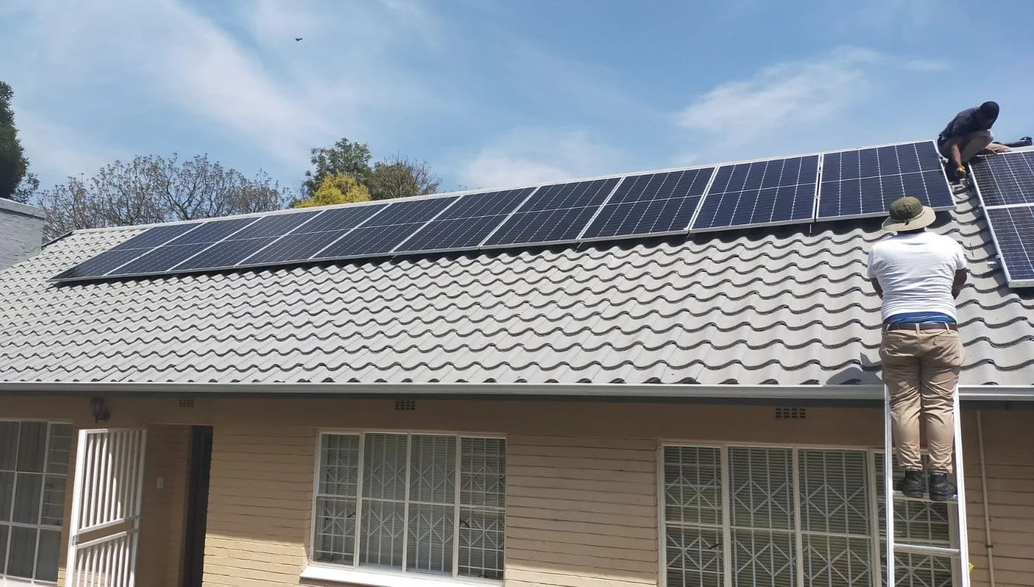 Full Solar Systems installers fitting panels to a Gauteng residential roof