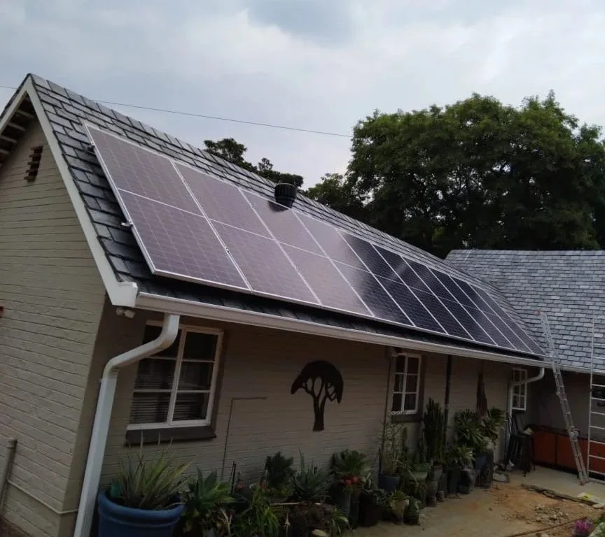 Solar panels installed across a tiled residential roof